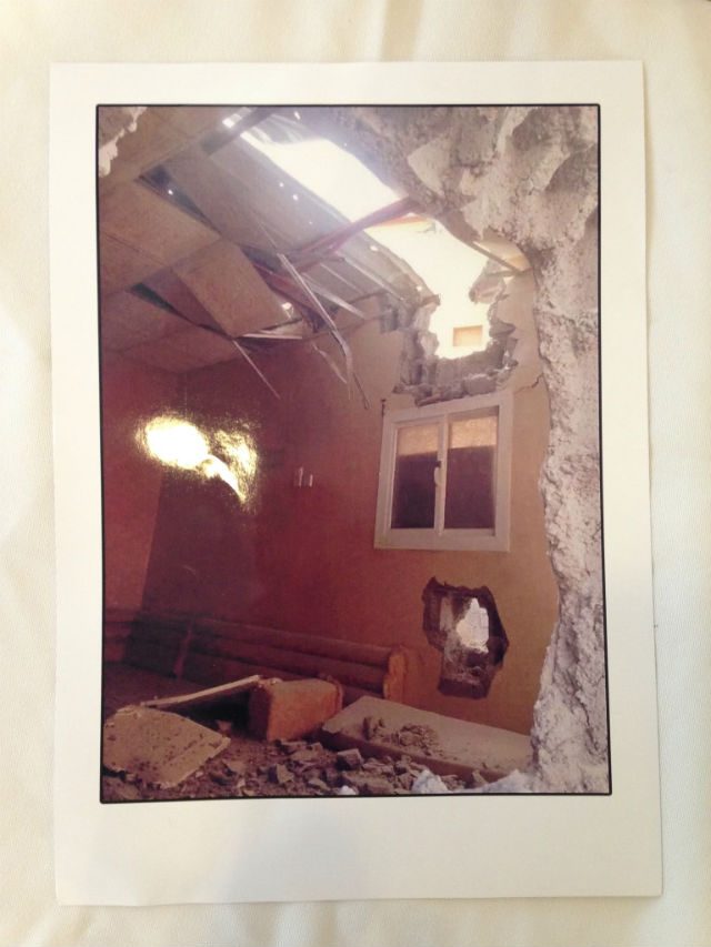 DESTROYED. A copy of a photo showing a facility near the Filipino community in Najran wrecked by a bomb. Photo by Mara Cepeda/Rappler 