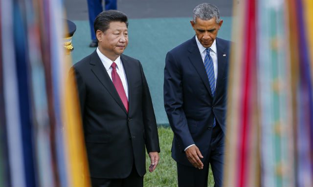 Obama, Xi make climate vow but clash on rights, islands