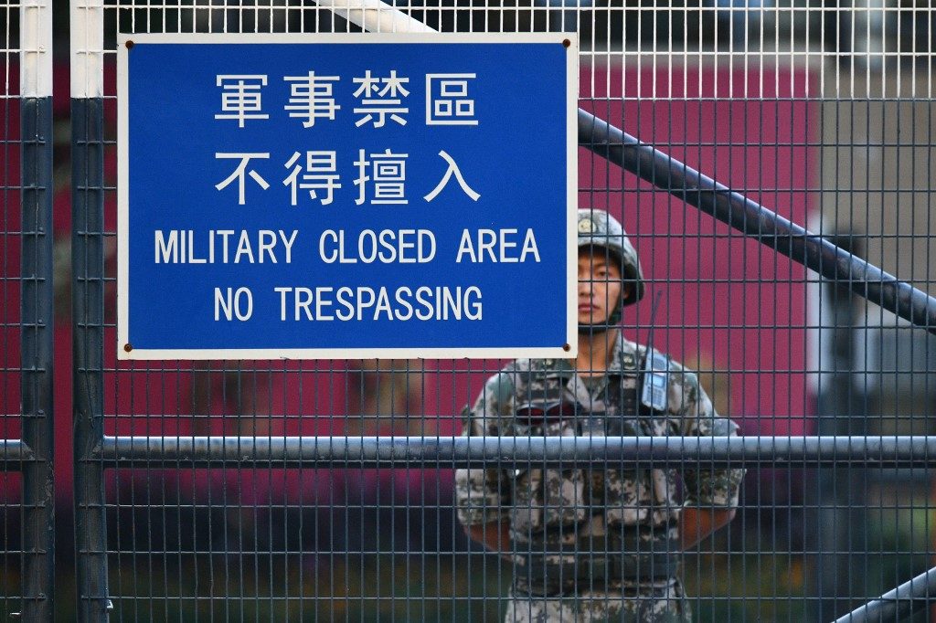 Chinese soldiers leave Hong Kong barracks in rare clean-up cameo