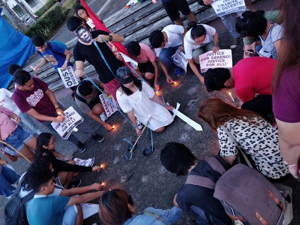 AGAINST SERENO OUSTER. The UPLB students light candles in protest of the Supreme Court decision to oust Chief Justice Sereno. Photo by Dyl Dalas  
