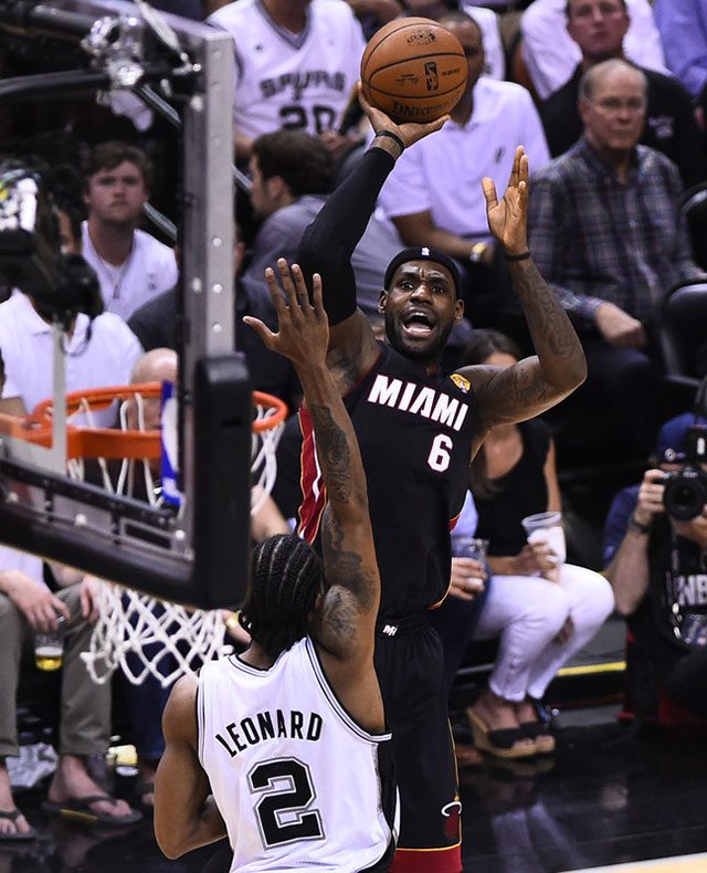 DEFENSE. Kawhi Leonard's defense was key in the series. Here he contests a LeBron jumper. Photo by Larry W Smith/EPA