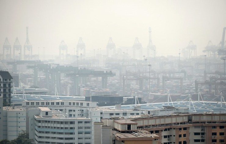 A general view over looking the Tanjong Pagar container port covered with smog in Singapore on September 15, 2014. Roslan Rahman/AFP