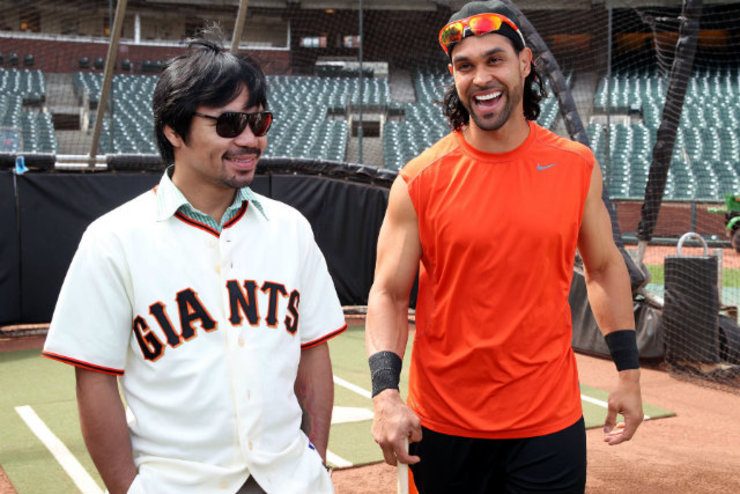 Manny Pacquiao shares a laugh with Giants outfielder Angel Pagan. Photo by Chris Farina - Top Rank