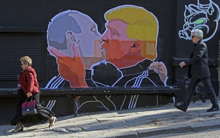 ‘Trump-Putin kiss’ graffiti shows misgivings in Baltic states