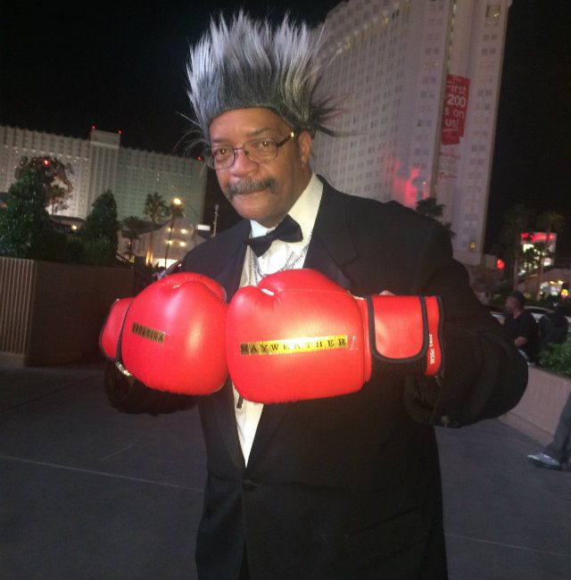 An entrepreneurial man poses as boxing promoter Don King - but a photo with him will cost a few bucks. Photo by Ryan Songalia 