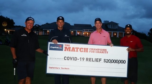 Woods-Manning prevail in star-studded match, raised $20m for charity
