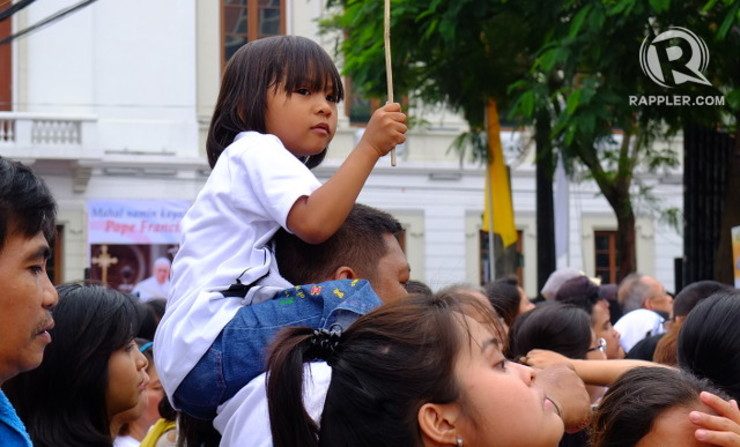 YOUNG CROWD. Many children were among the crowd outside Manila Cathedral
