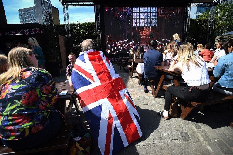 From East End to Markle village, divided Brits unite for wedding revelry