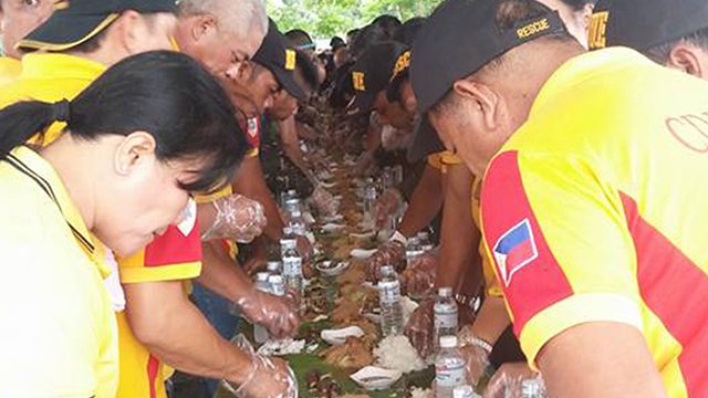 UNITY. Laguna responders engage in a boodle fight to show fellowship after the drill. Photo by OCD-RDRRMC CALABARZON.  