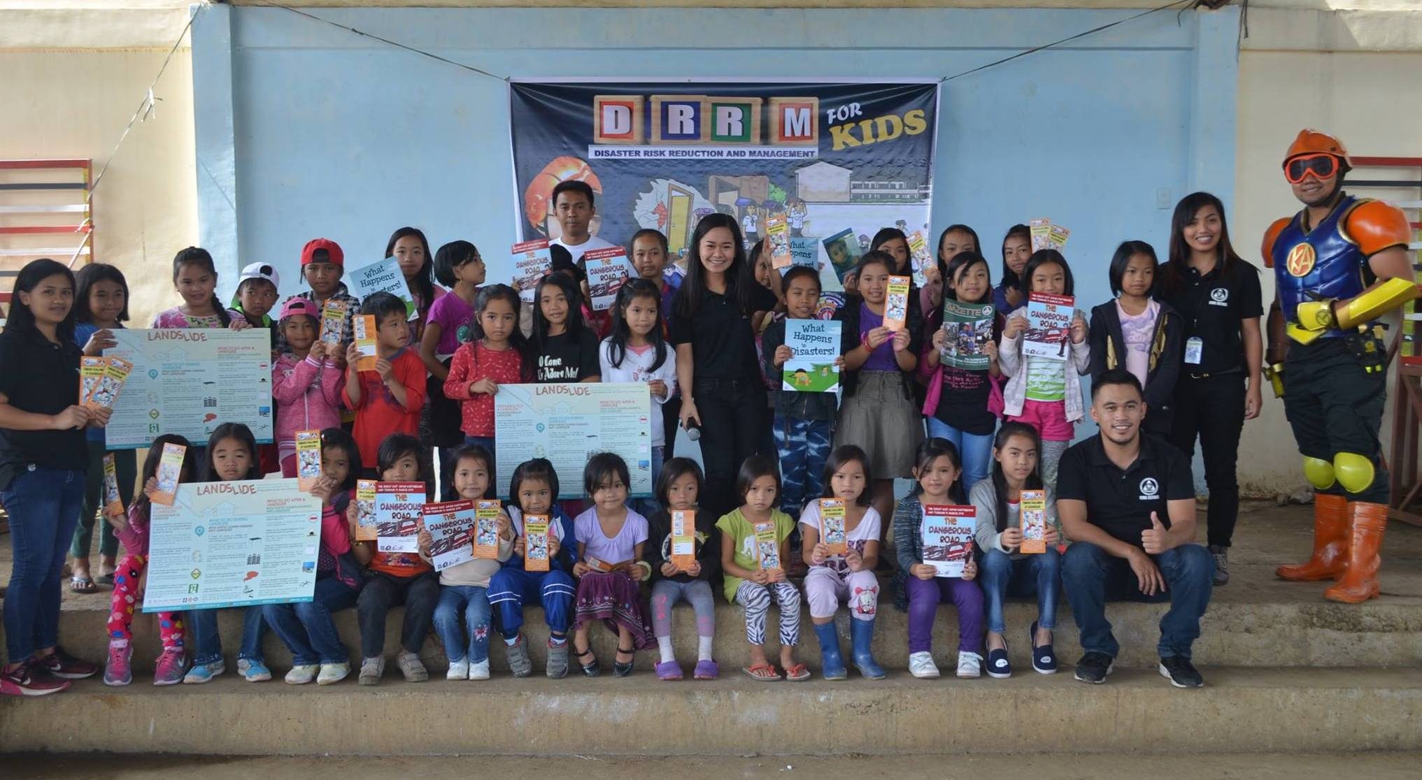 ALL SMILES. Puguis Elementary school students pose with the IEC materials turned over by OCD-CAR to provide more ways for disaster preparedness to be accessible to the students. Photo courtesy of Civil Defense Cordillera