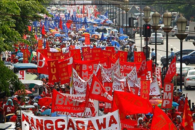 NAGKAISA. Thousand of workers belonging to Nagkaisa on their way to Mendiola, 01 May 2014. Photo by Ritchie Tongo/EPA