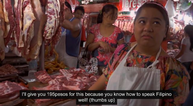 SHOPPING. Vendors at the wet market wondered about the Vegemite to be used as part of Chris' adobo recipe. Screengrab from YouTube