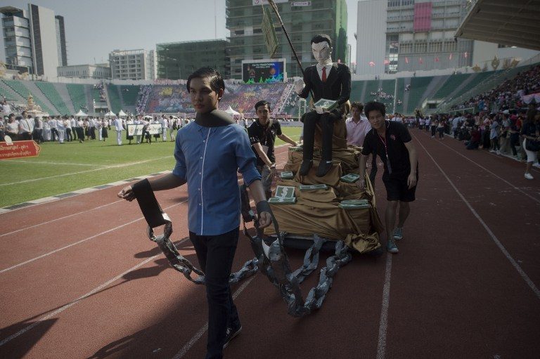 Thai students mock military at football match