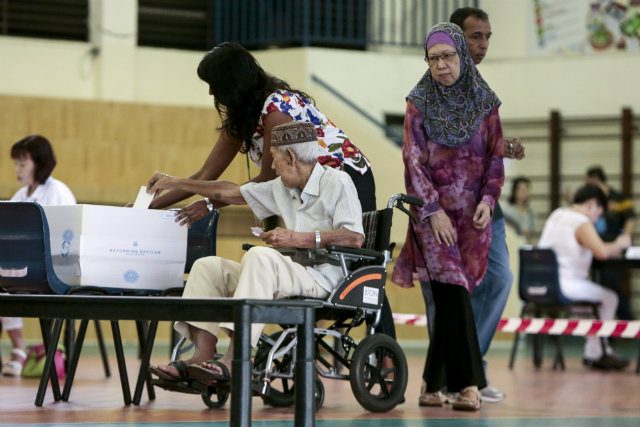 CRUCIAL VOTE. Singapore has 2.46 million eligible voters mandated to vote in an election where the ruling party faces the stiffest competition since independence. Photo by Wallace Woon/EPA 