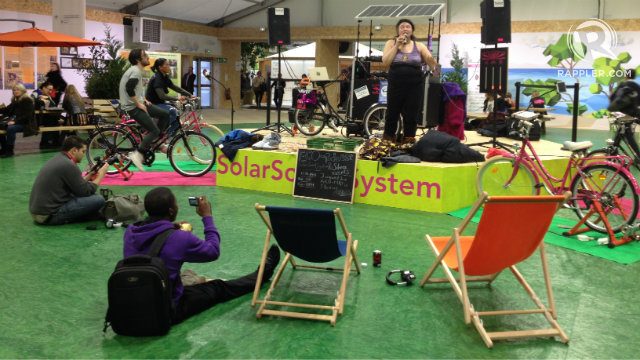 MUSIC. A mini concert in the civil societies area in COP 21. The sound system is powered by cyclists. Photo by Fritzie Rodriguez/Rappler  