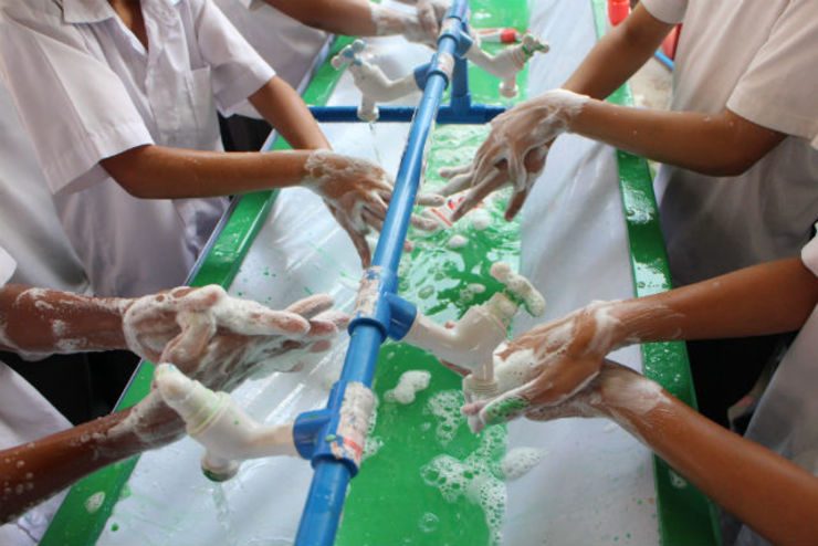 SOAP UP. The students from Air Force City School in Pampanga practice proper handwashing. 