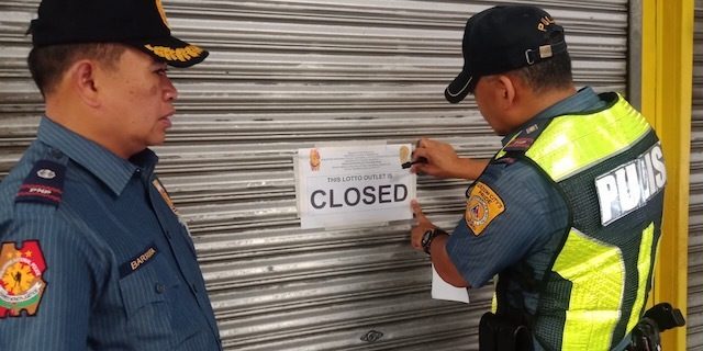PRESIDENT'S ORDER. Police close down a lottery outlet in Quezon City on Saturday, July 27. QCPD photo  