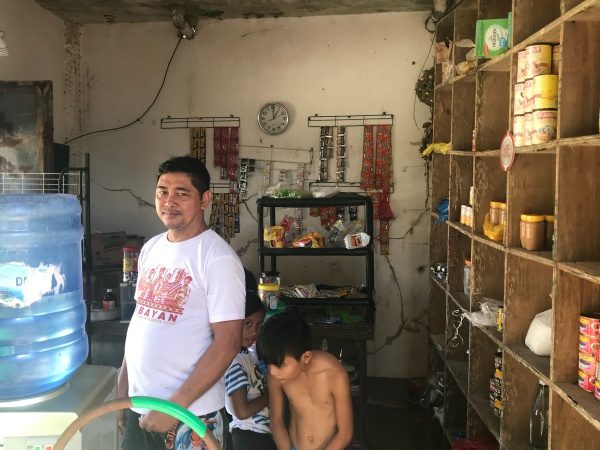 AFFECTED. 50-year-old Emiliano Daiz' retail store was also flooded by Typhoon Ursula. His goods were soaked with the heavy rains and flood. Photo by Jene-Anne Pangue/Rappler 