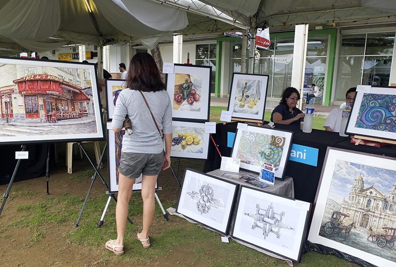 PAINTINGS. A number of artists also display their work at the market, and you can pick up an original work or two, too