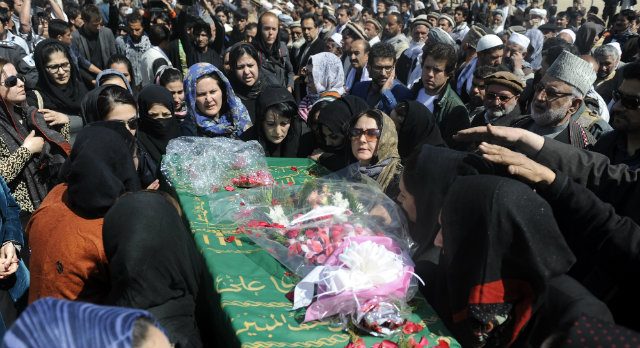 Hundreds of Afghans bury woman beaten to death by mob