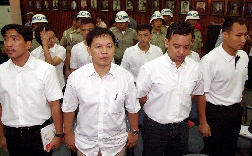 FACING THE COURT. Detained junior officers who led a failed coup, from left: Navy Lit Senior Grade James Layug, Army Captain Maestrecampo, Navy Lieautenant Senior Grade Antonio Trillanes and Marine Captain Gary Alejano. File photo by AFP