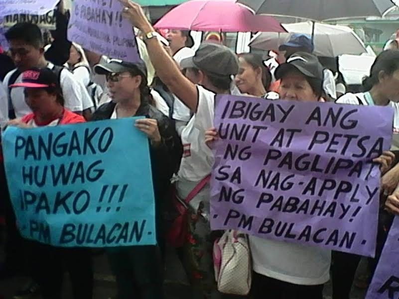 Bulacan informal settlers urge NHA to approve housing applications
