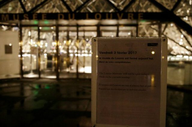 PARIS ATTACKS. A placard reading "the Louvre museum will not be open today" is displayed at the entrance of the Louvre museum in Paris, on February 3, 2017, after a French soldier patrolling at the Louvre shot and seriously injured a machete-wielding attacker earlier. The man wielded a machete and shouted "Allahu Akbar" ("God is greatest") as he lunged at soldiers patrolling outside the Louvre, home to the Mona Lisa and one of the world's most-visited museums. Security forces described the attacker as being in a serious condition while one soldier suffered a minor head wound. A second machete, along with cans of spray paint were found in the man's backpack.GEOFFROY VAN DER HASSELT / AFP 