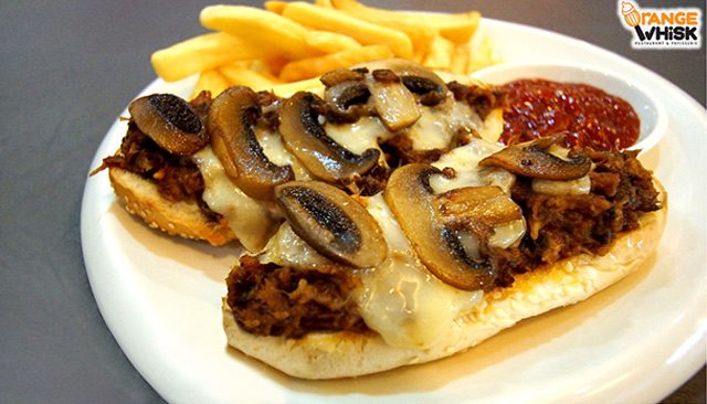 HUGE. Take a bite of this Mushroom Mozzarella Melt BBQ Pulled Pork Sandwich with Fries. 