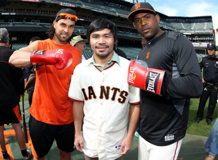 Pacquiao poses with San Francisco Giants players Angel Pagan (L) and Santiago Casilla. Photo by Chris Farina - Top Rank