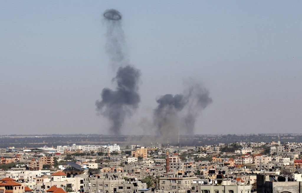 Dozens of rockets fired from Gaza, Israeli response kills one