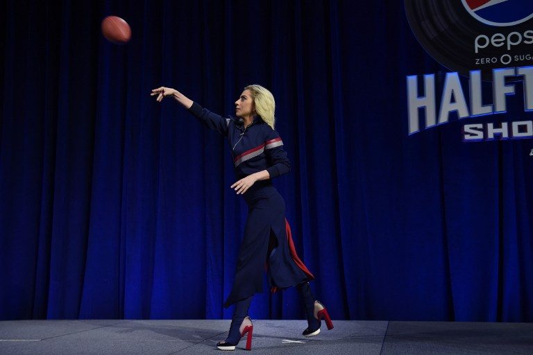 GAGA FOR FOOTBALL. Lady Gaga, seen showing off her throwing arm at a Super Bowl press event, will occupy a prominent podium in Houston during halftime. Photo by Timothy A. Clary/AFP 
