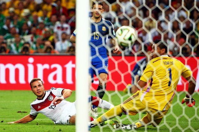SUPER MARIO. Germany's Mario Gotze scores the lone goal of the World Cup Final. Photo by Diego Azubel/EPA