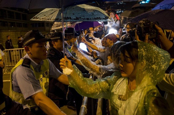 Protesters press HK leader to quit, China tells US to back off