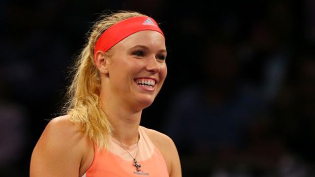 Wozniacki puts title thoughts aside after last-16 romp