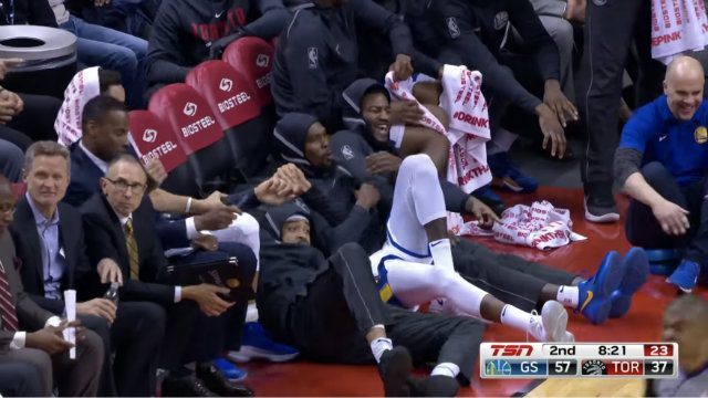 WATCH: Warriors bench has jokes for Ibaka after he falls guarding Thompson