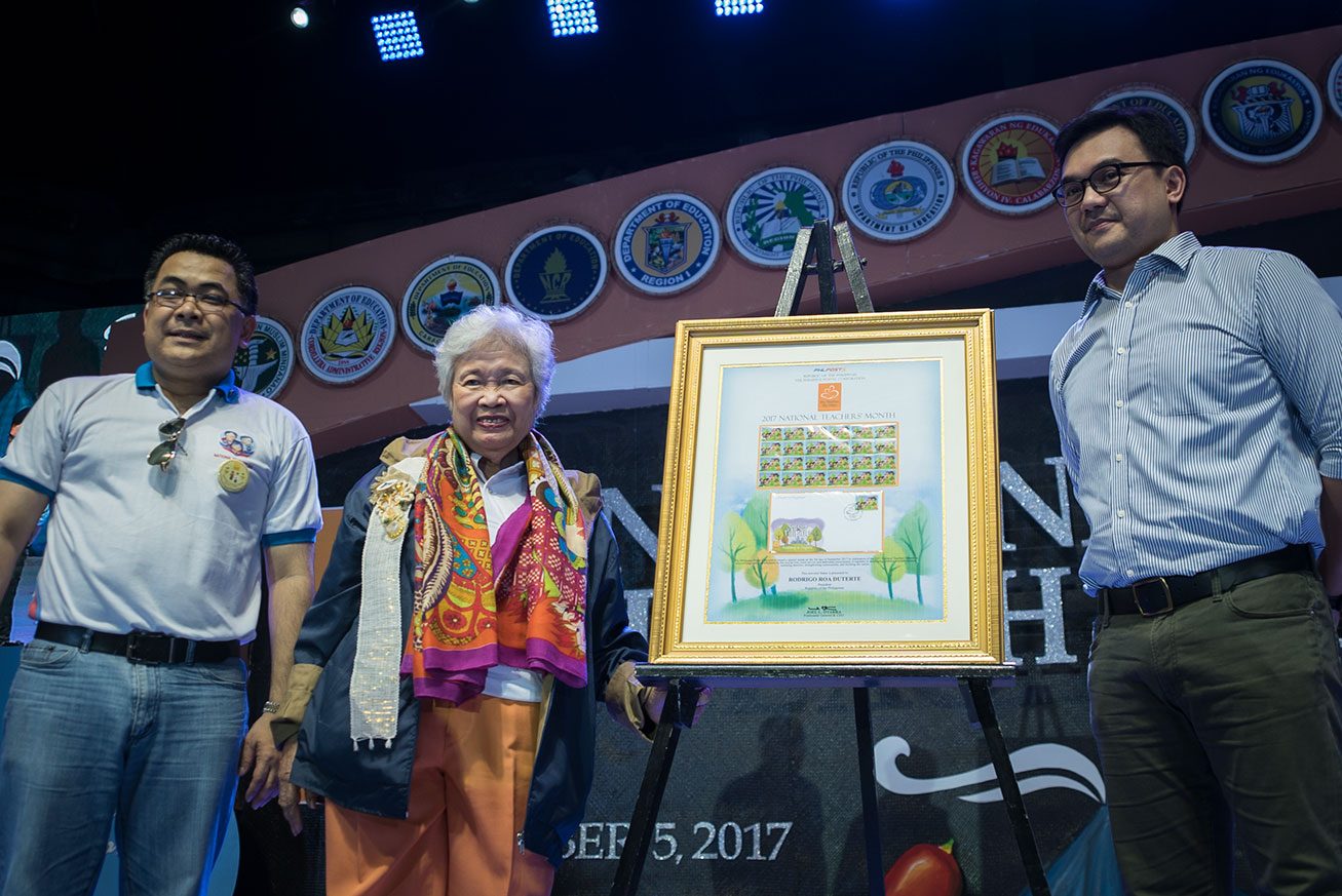 STAMPS. PhilPost turns over special commemorative stamps to the Department of Education, through Assistant Secretary Tonisito Umali (L) and Secretary Leonor Briones (center) during the National Teachers' Day celebration 