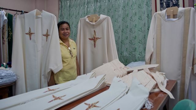 LABOR OF LOVE. Rose Padel with the chasubles to be worn by the bishops, priests, and deacons who will be Pope Francis' concelebrants.