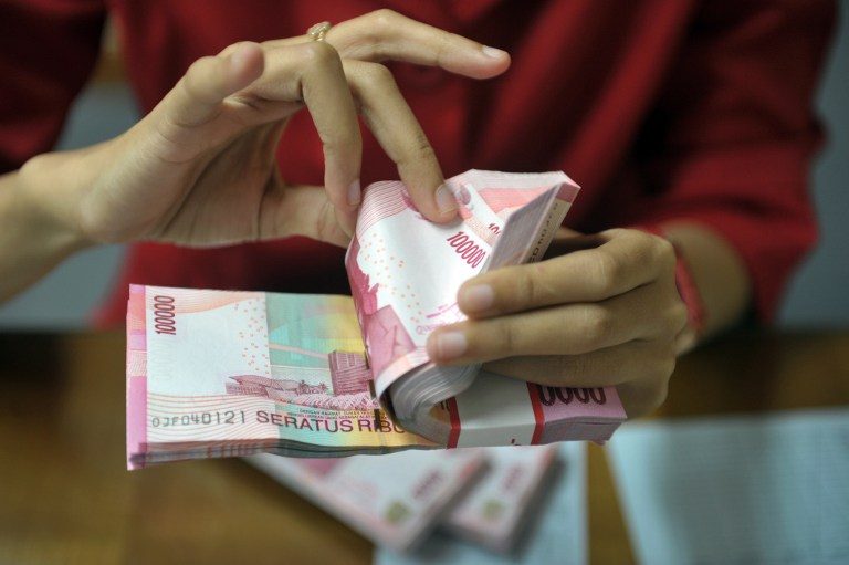 DOWN. Indonesian rupiah has been hit by signs of recovery in the American economy. File photo by AFP 