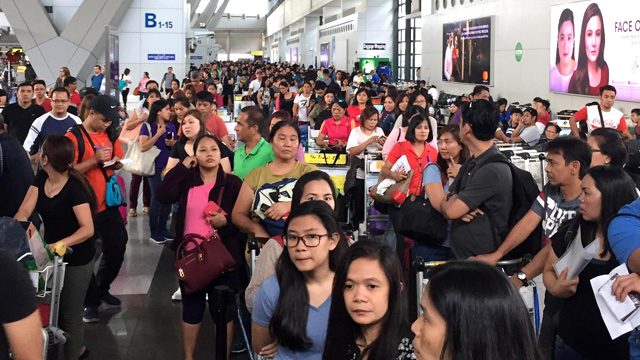 OFWs suffer long lines in NAIA due to broken system