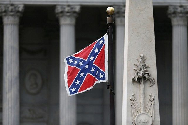 US protester removes Confederate flag at state house