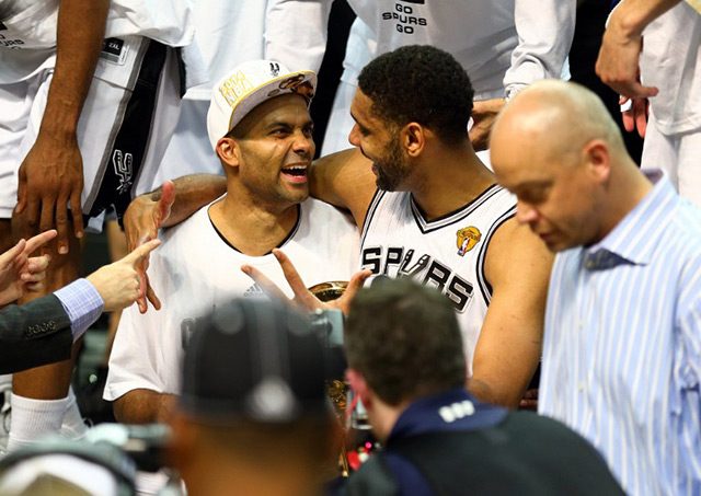 HAPPY VETERANS. Tony Parker and Tim Duncan share a light moment after winning the 2014 NBA title. Photo by Andy Lyons/AFP
