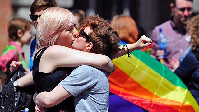 CELEBRATION. A couple kiss after early results suggest an overwhelming majority in favor of the referendum on same-sex marriage, in Dublin, Ireland, 23 May 2015. Aidan Crawey/EPA 