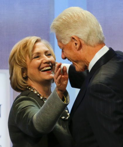 POWER COUPLE. Will Hillary become the second Clinton to lead the global superpower? File photo by Ray Stubblebine/AFP  