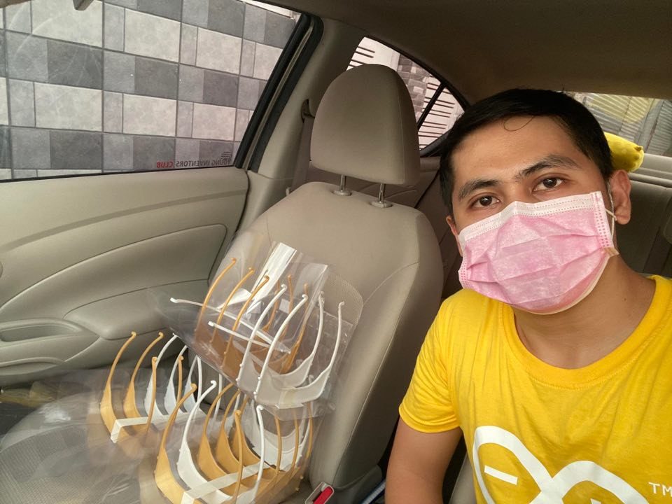 FACE SHIELDS. Engr. Kevin Daga-as, in-charge of Makerspace at PSHS-SOCCSKSARGEN Region Campus loads the face shields for distribution in Koronadal City. 