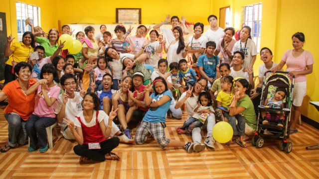 WACKY! CADS members pose with the CBR-SMILE children and their parents after a session. Photo by Christopher King of CADS    
