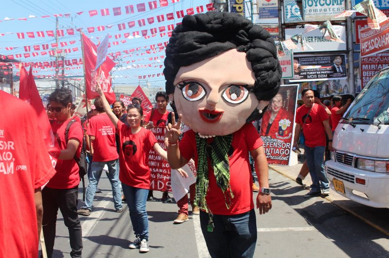 MIRIAM MASCOT. A supporter of Miriam Defensor Santiago shows off her support with a mascot of the senator. Photo by Mary Macaraeg/Rappler.com  