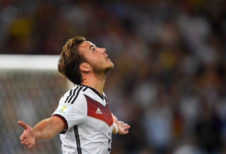 Miroslav Klose's replacement at the 88th minute Mario Mario Götze celebrates after scoring during the World Cup final. Photo by Odd Andersen/AFP