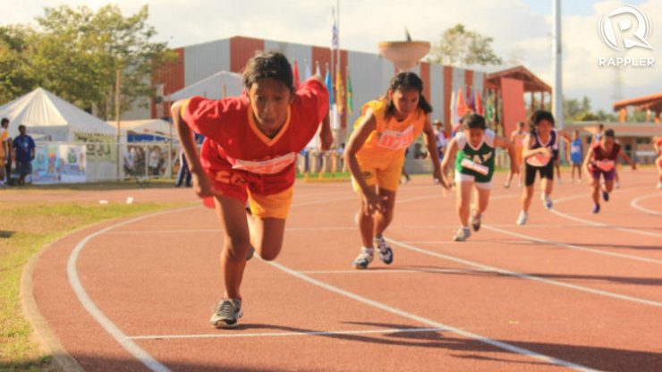 A young girl from Central Luzon region mid-stride during the 200 meter run during the Special Games. Photo by Maan Tengco/Rappler