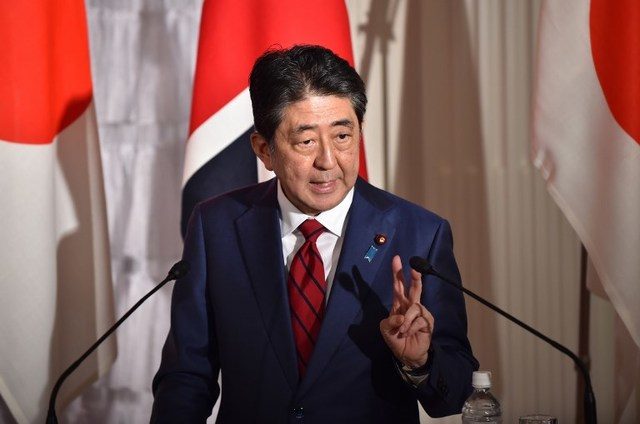 Japan PM Abe pledges constitution change amid scandal