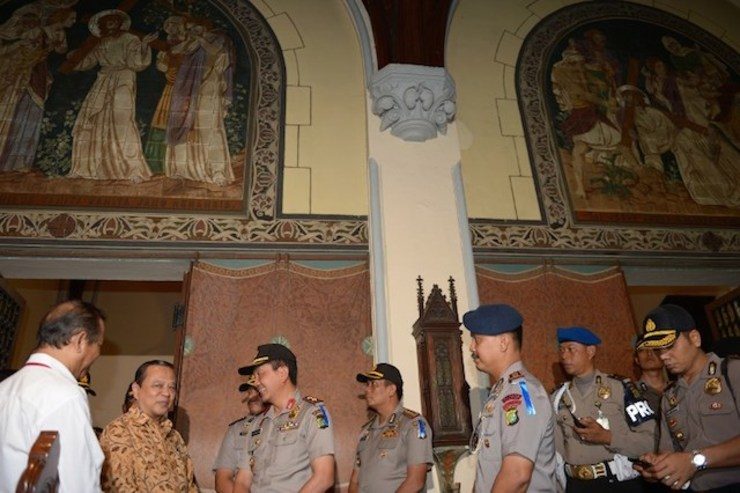 Jakarta police officers visit the cathedral to examine its preparation for Christmas eve in Jakarta in this file photo taken on December 23, 2013. Photo by Adek Berry/AFP